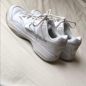 White and silver Nike Court Lite shoes.